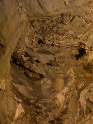 Light shows the folds of a rock wall inside Vrelo Cave at Matka near Skopje.