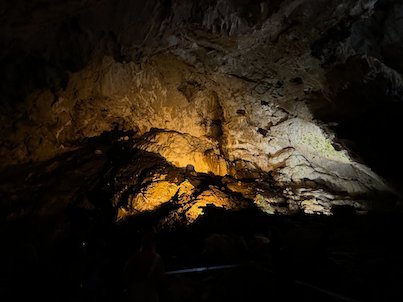 Lights show a wide rock chamber inside Vrelo Cave at Matka near Skopje.