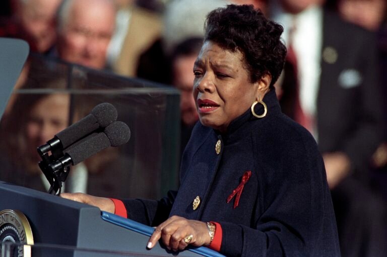 Maya Angelou at a podium on the inaugural stage, reading her poem in Washington, D.C., 1993