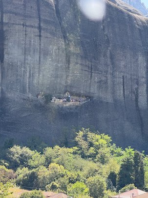 Old hermitage in a cave high in the cliff face at Meteora
