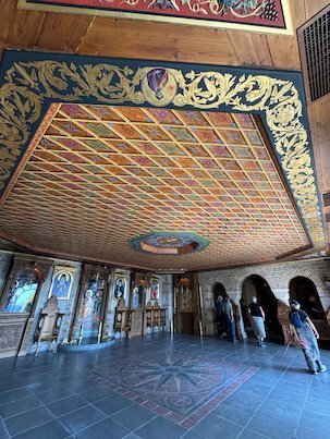Painted wooden ceiling and icons inside a church at Meteora