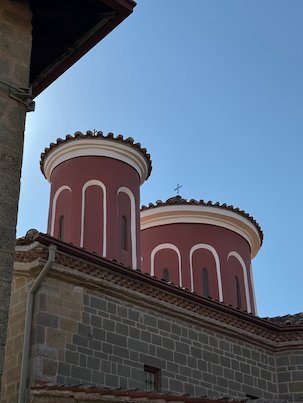 Two red domes of a church at a Meteora monastery
