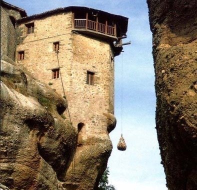 Monastery tower with a net that hangs from a rope at Meteora
