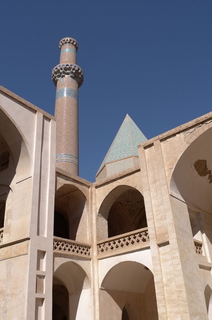 Minaret and two-floor arches in the courtyard of the Jameh Mosque of Natanz