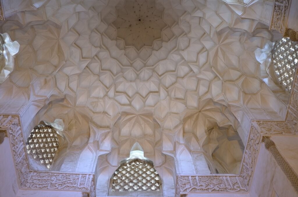 White muqarnas ceiling with lattice windows at the Jameh Mosque of Natanz