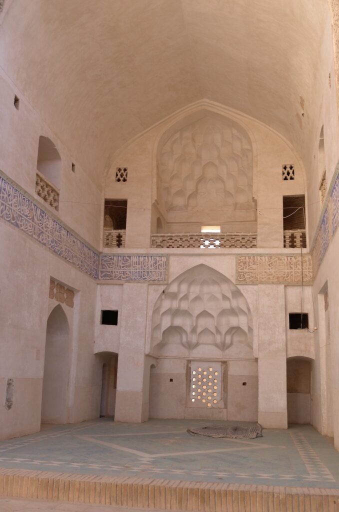 White hall with carved niches at the Jameh Mosque of Natanz