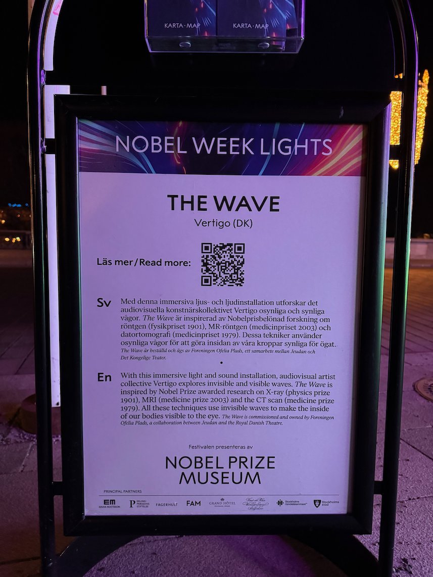 Information sign for The Wave by Vertigo, a light and sound artwork about invisible waves, Nobel Week Lights