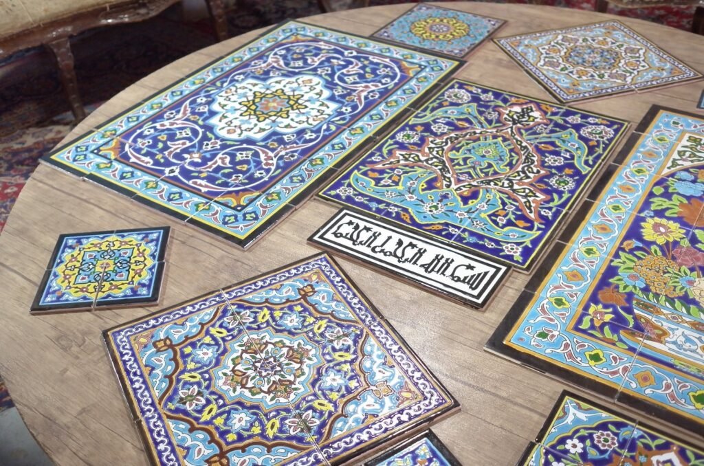 Painted tiles for sale on a table in Isfahan
