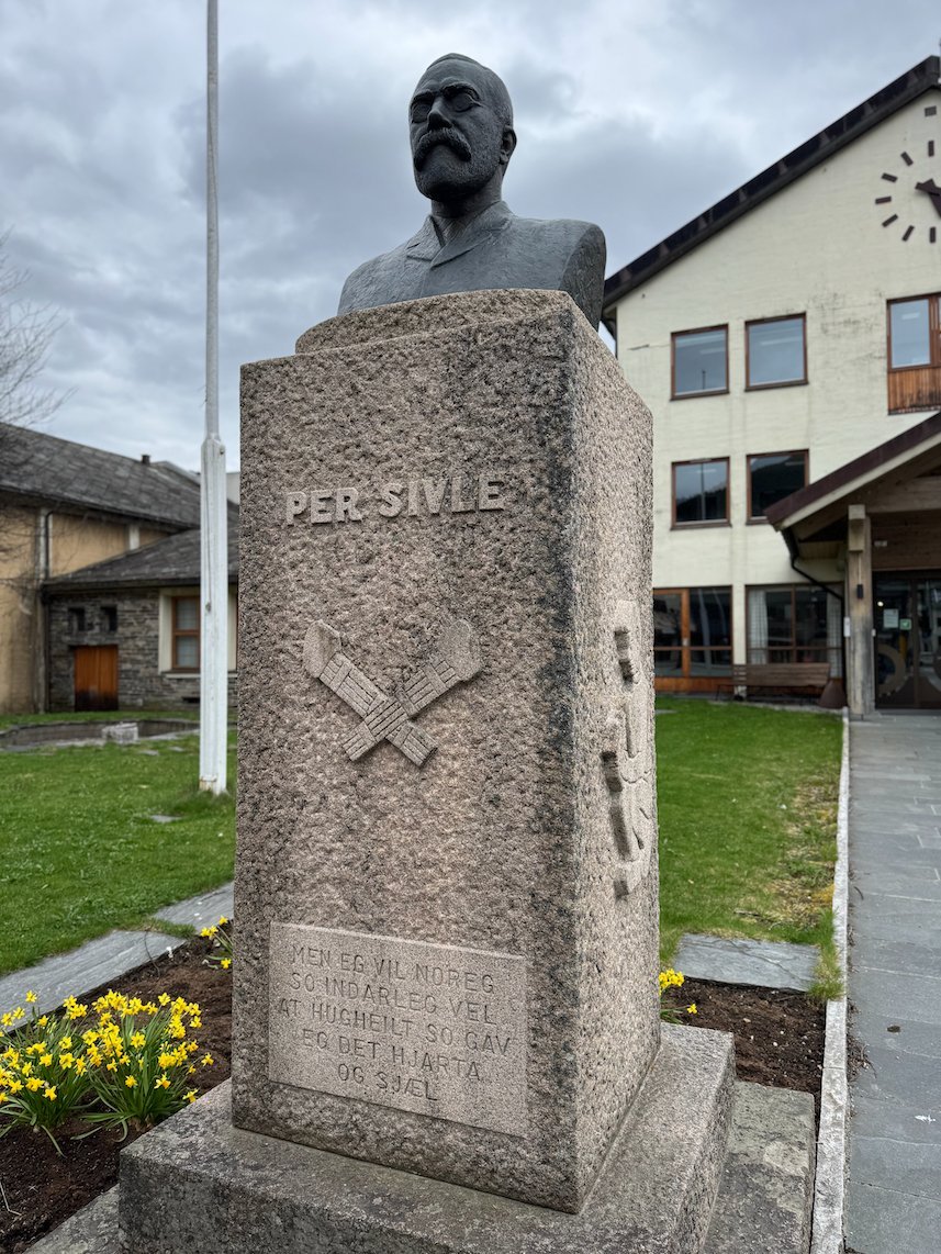 Bronze bust of the poet Per Sivle on a stone pillar in Voss