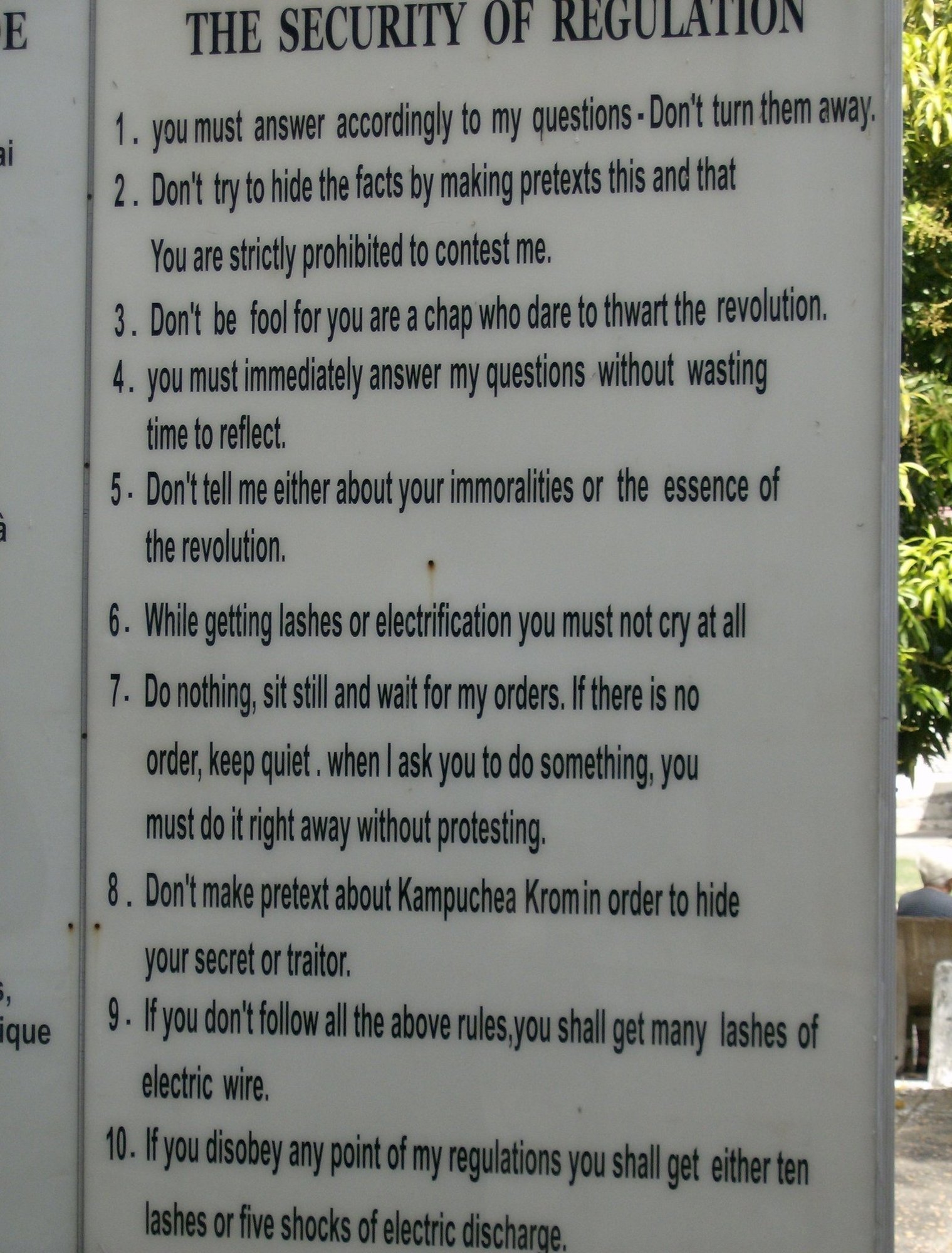 A sign at Tuol Sleng Genocide Museum in Phnom Penh lists the prison security rules.