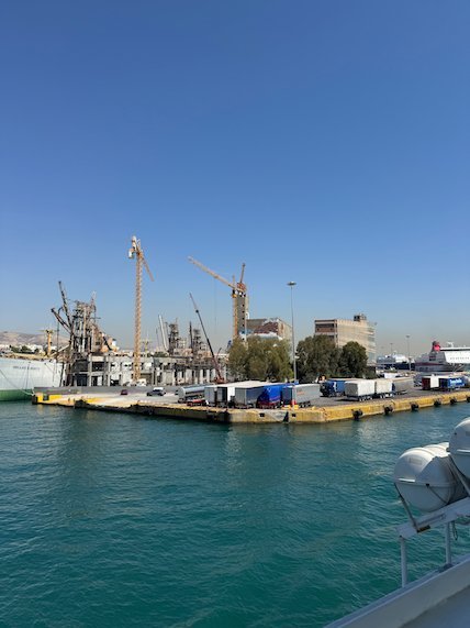 Cranes and quays in the port of Piraeus seen from the ferry