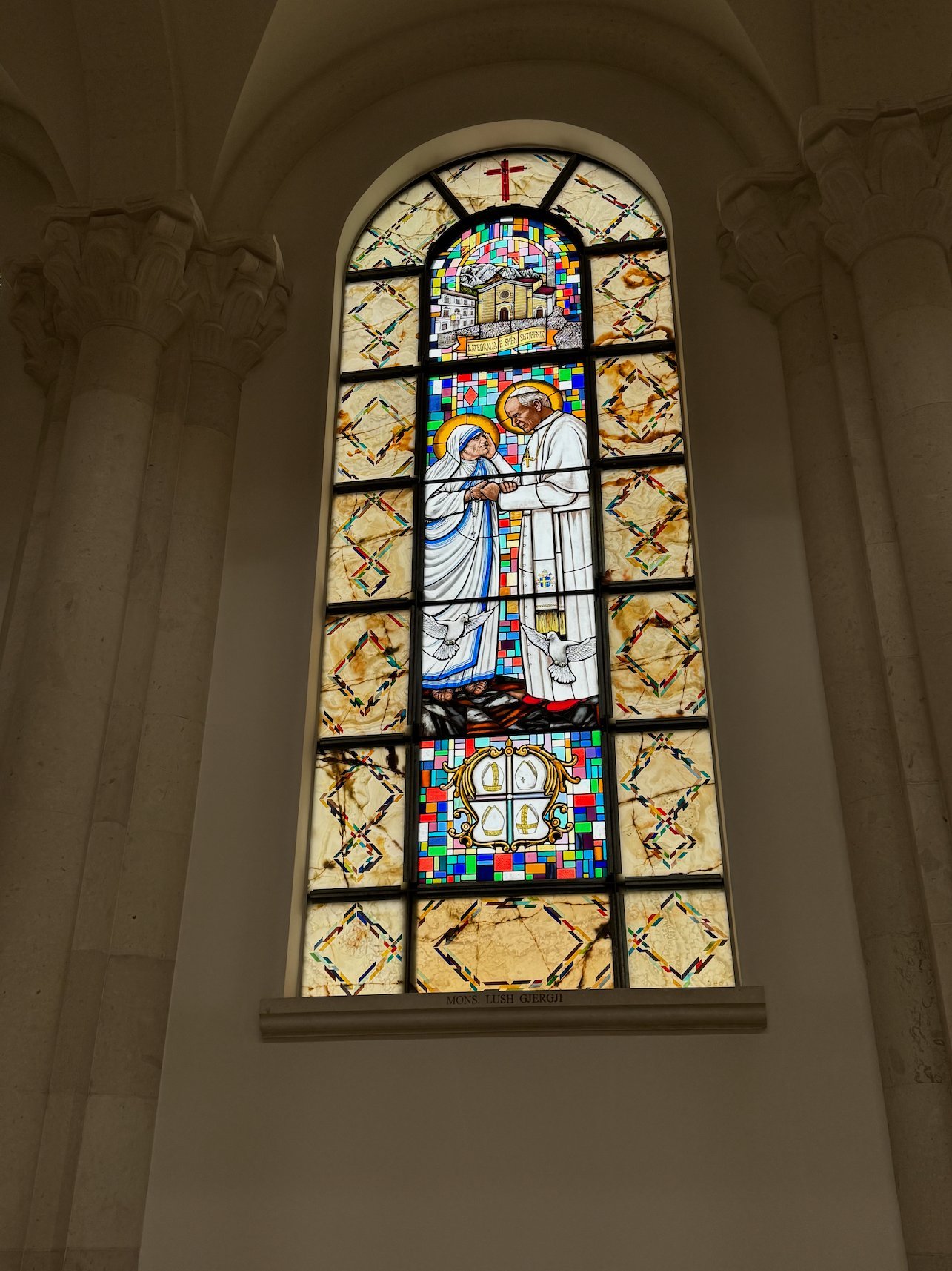 A stained glass window shows Mother Teresa in the Cathedral of Saint Mother Teresa in Pristina.