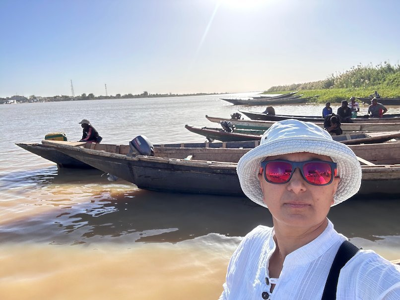Zayera Khan takes a selfie by pirogues on the Senegal River.