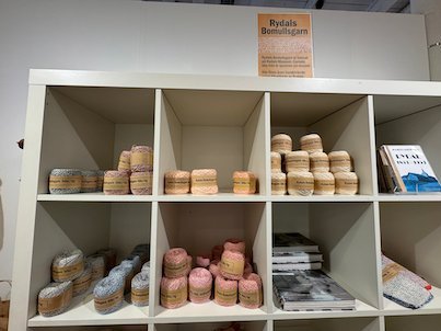 Shelves with yarn and books in the Rydals museum shop