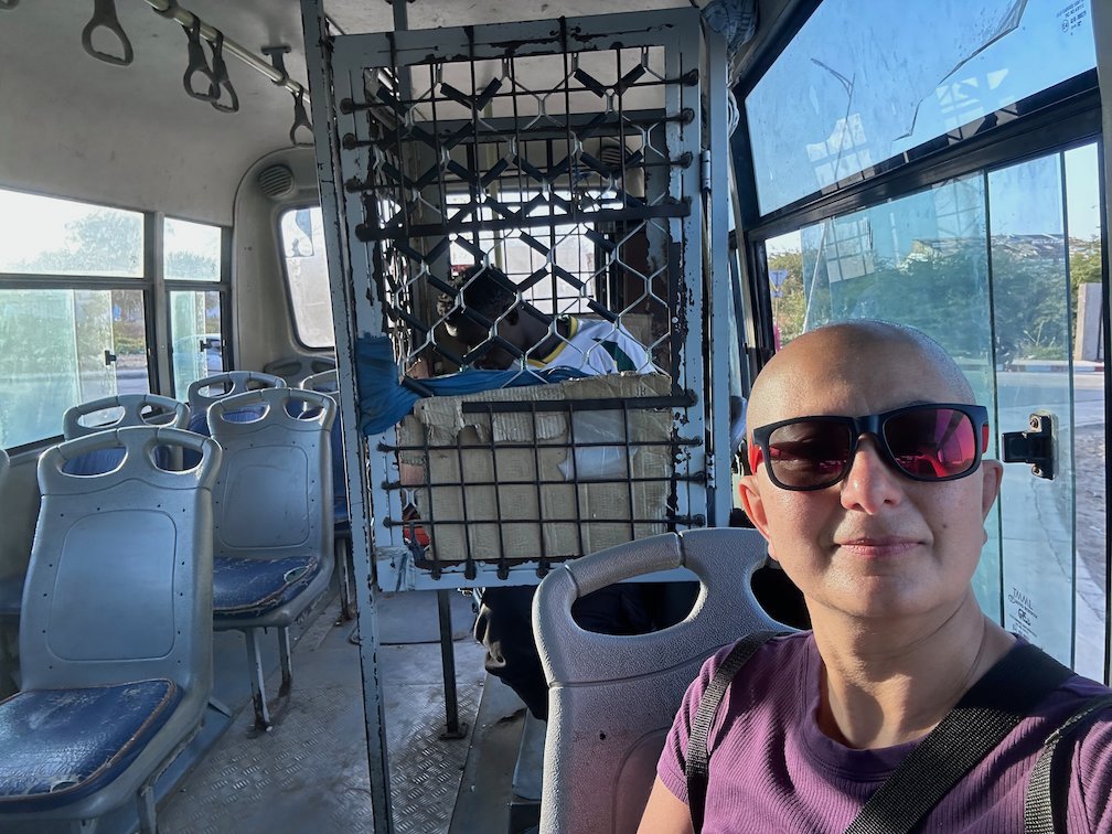 Zayera Khan in sunglasses takes a selfie on a bus in Senegal.