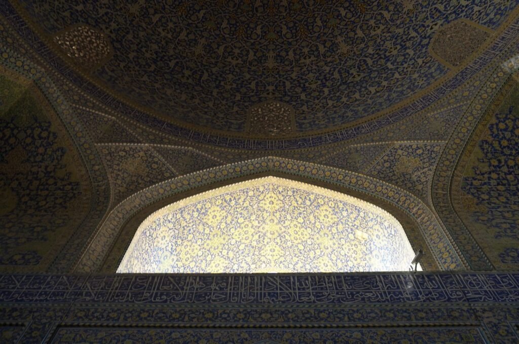 Dark dome and a bright window in the Shah Mosque