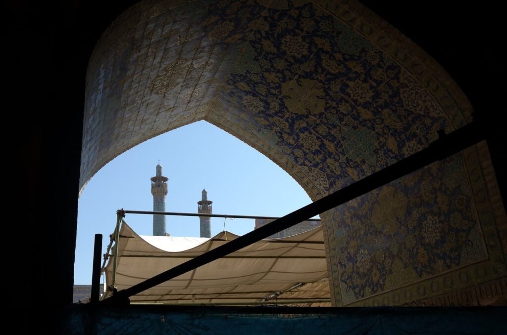 Minarets seen through a tiled arch in the Shah Mosque