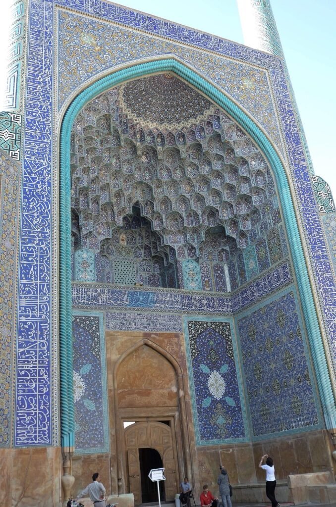 Entrance portal of the Shah Mosque with muqarnas and blue tiles