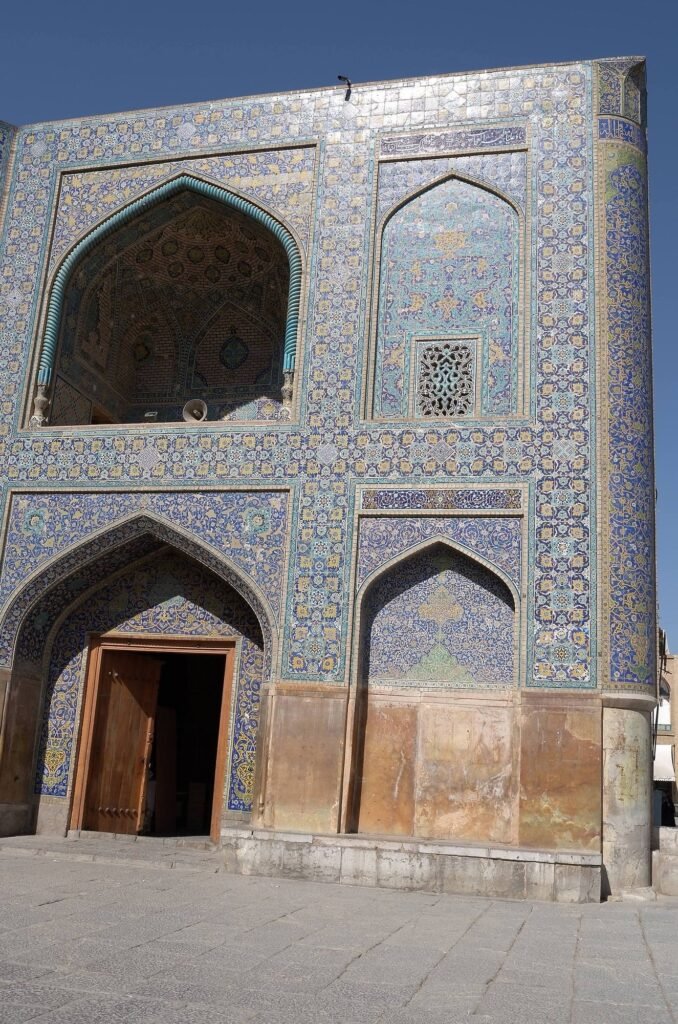 Corner of the tiled facade of the Shah Mosque