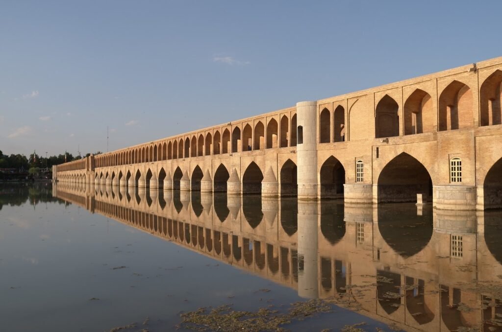 Si-o-se-pol bridge and its arches reflected in the water at sunset