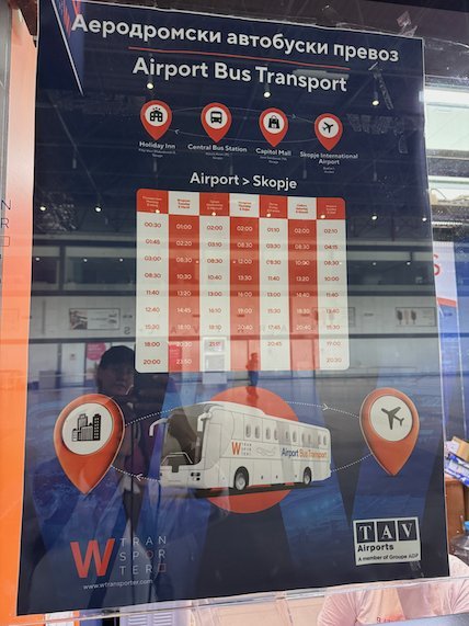 A poster at Skopje airport shows the airport bus timetable to the city centre.