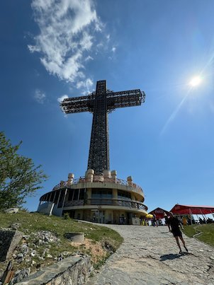 The steel frame of the Millennium Cross rises above its round base on Mount Vodno near Skopje.