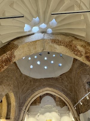 Small star-shaped skylights let light into the dome of an old Ottoman bath in Skopje.