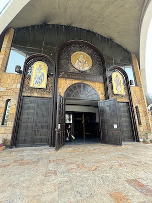 Icons decorate the wooden entrance doors of St. Clement of Ohrid Church in Skopje.
