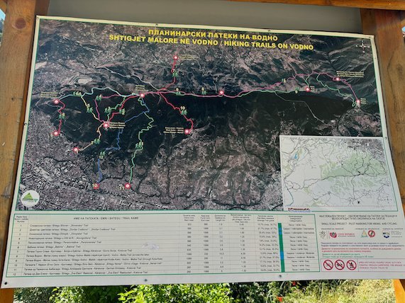 A map board with a list of routes shows the hiking trails on Mount Vodno near Skopje.