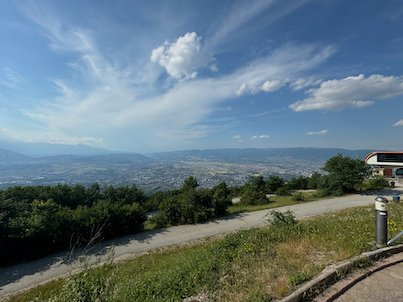 The Skopje valley spreads below green hills in a view from Mount Vodno.