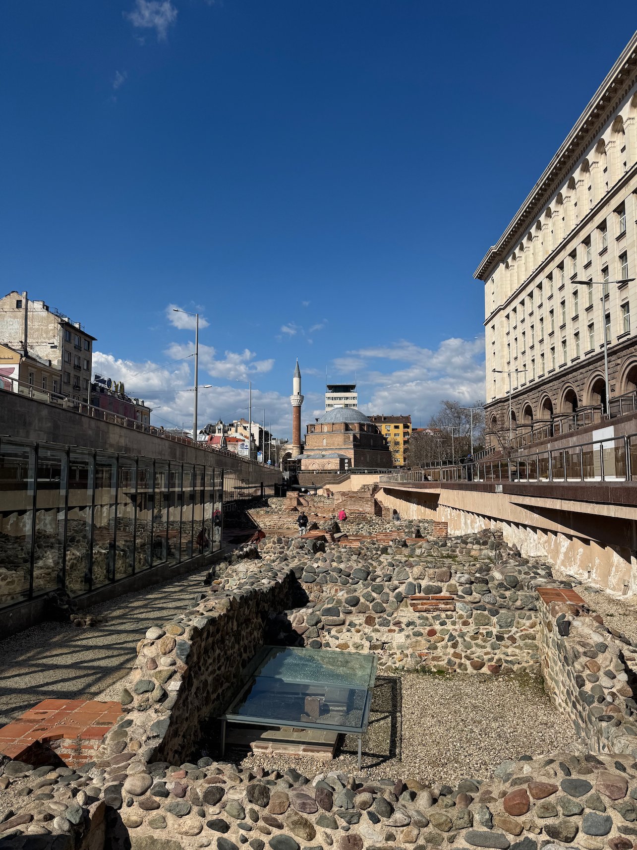 Excavated Roman ruins of Serdica lie open in the city centre, with a minaret behind them in Sofia.