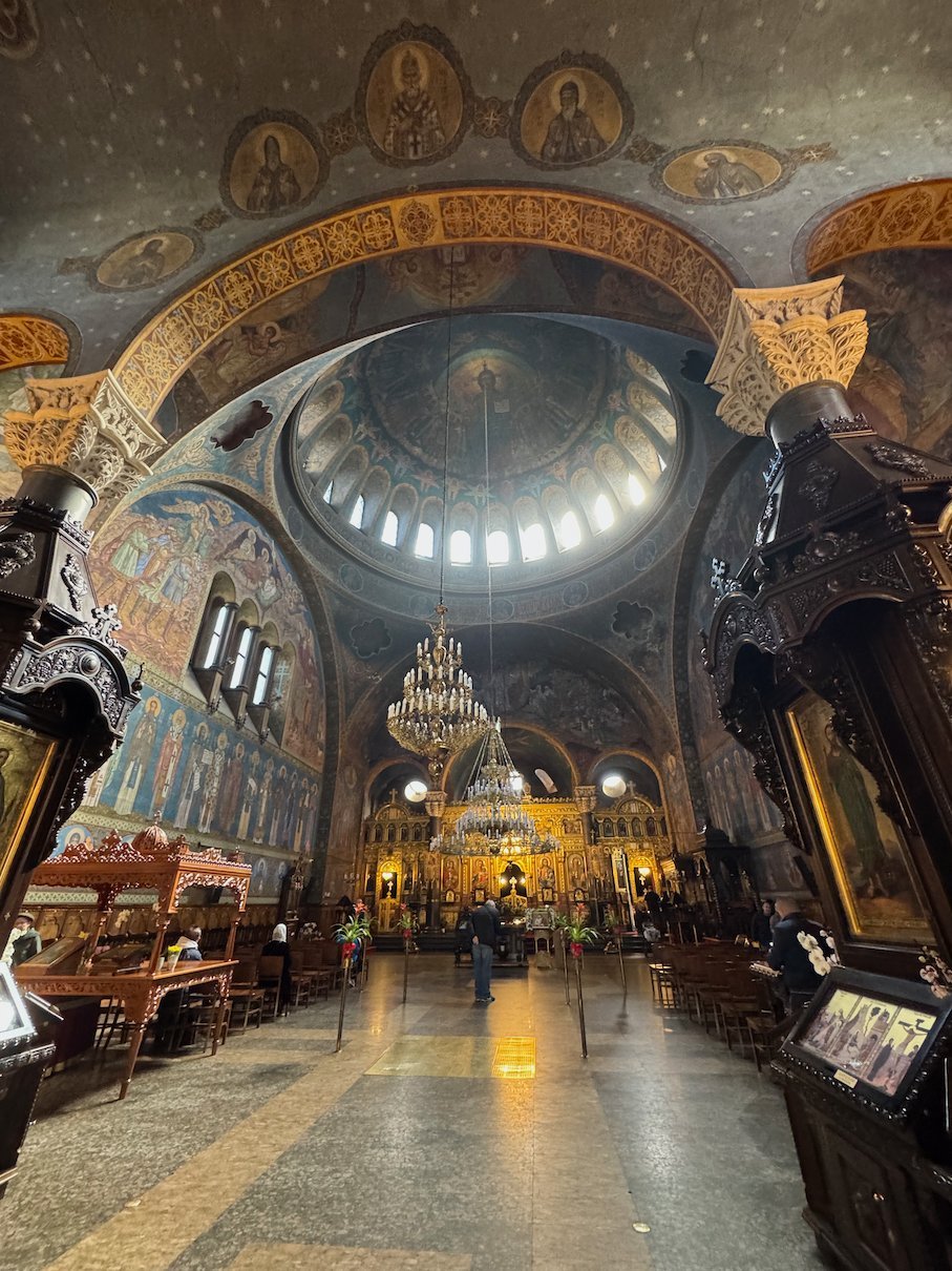 Frescoes, a chandelier and a gold iconostasis fill the interior of Sveta Nedelya Cathedral in Sofia.