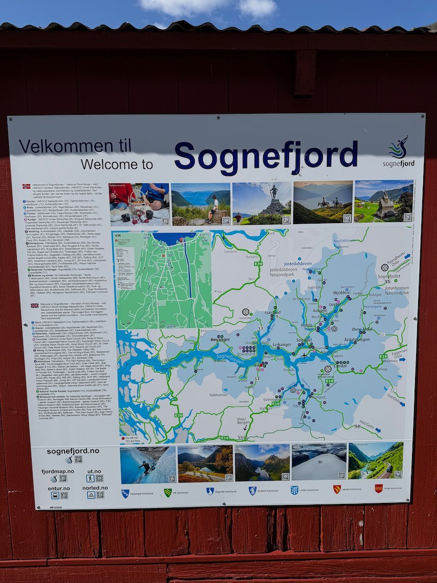 Map board Welcome to Sognefjord on a red wooden wall