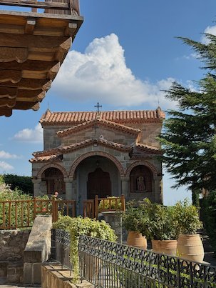 Small chapel with plants in clay pots at St. Stephen's Monastery, Meteora