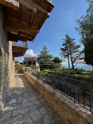 Stone walkway and garden along the wall of St. Stephen's Monastery