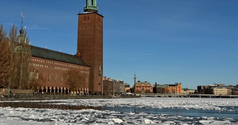 Stockholm City Hall across ice and snow on Riddarfjärden in winter