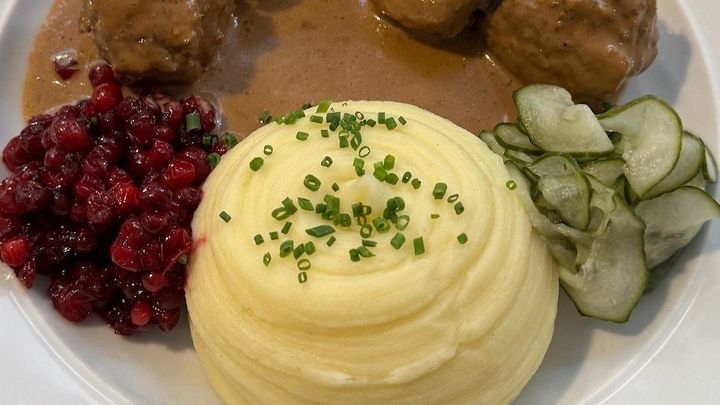 Traditional Swedish meatballs with lingonberry sauce at a Stockholm restaurant, photographed by Zayera Khan