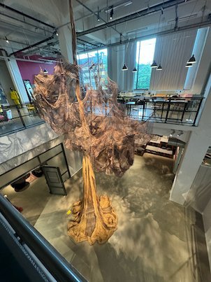 Large hanging textile sculpture in the atrium of the Textile Fashion Center