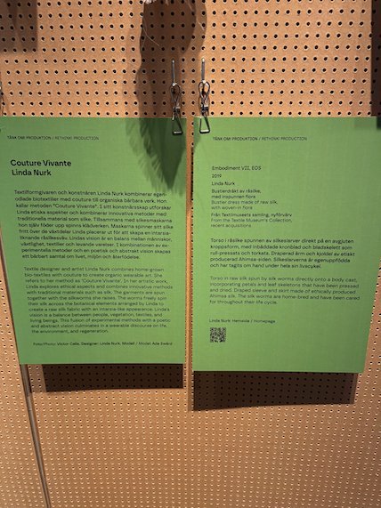 Green signs about Couture Vivante and other works