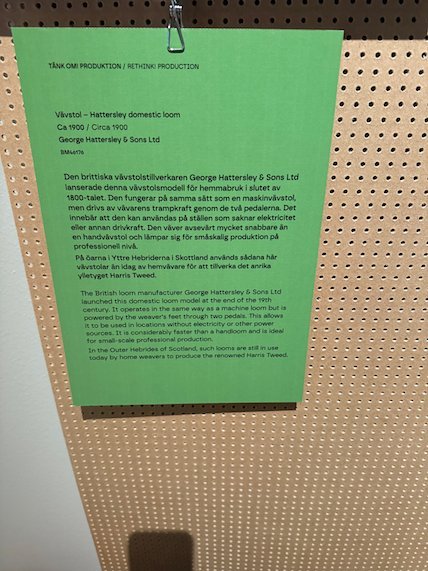 Green sign about a domestic loom by George Hattersley and Sons