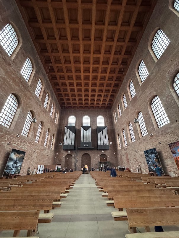 Wooden pews lead to the organ inside the Aula Palatina, the Basilica of Constantine in Trier.
