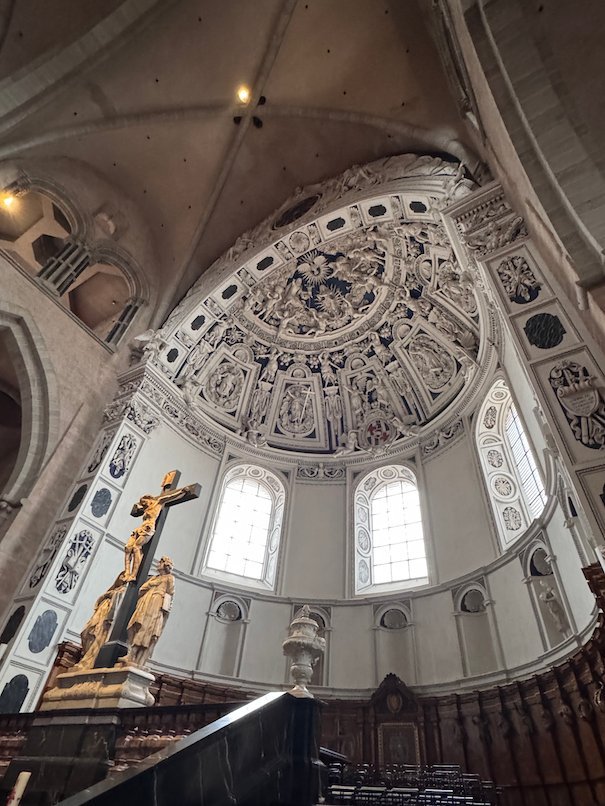 White stucco decoration fills the apse above the choir in Trier Cathedral.