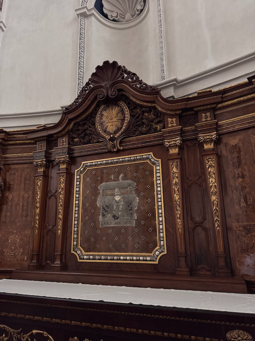 A carved wooden altar with gold details stands in Trier Cathedral.