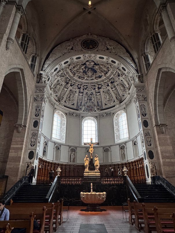 Steps lead up to the choir under the baroque apse of Trier Cathedral.