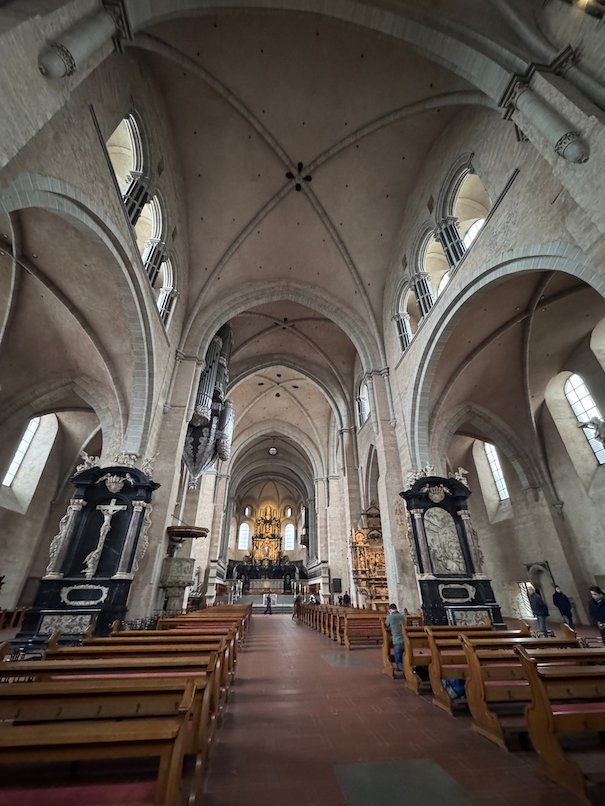 The long nave of Trier Cathedral leads to the golden altar.