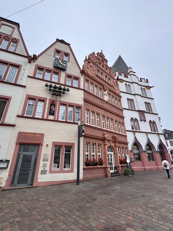 Colorful historic houses line the Hauptmarkt square in Trier.