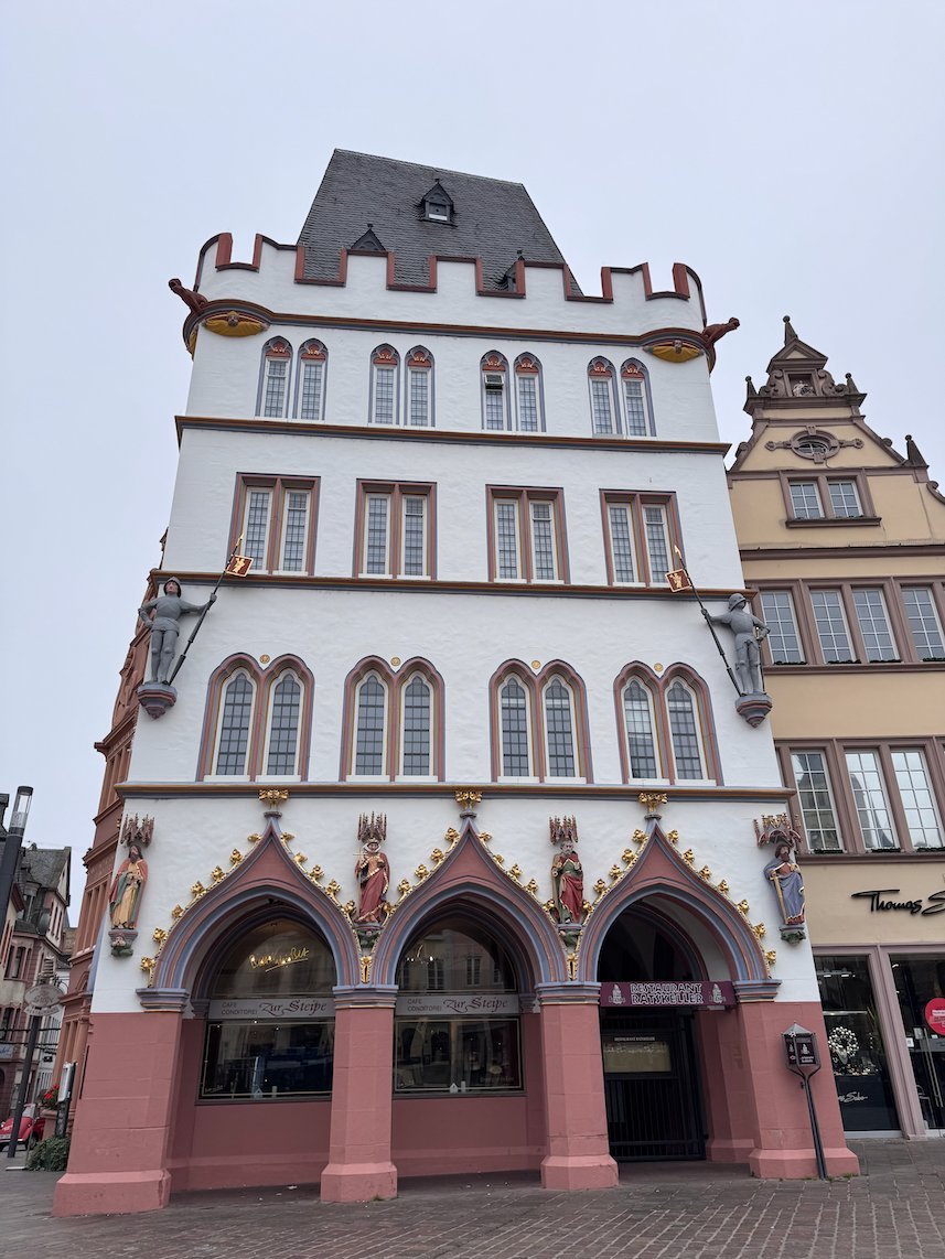 The Steipe, a white and red Gothic house, stands on the Hauptmarkt in Trier.