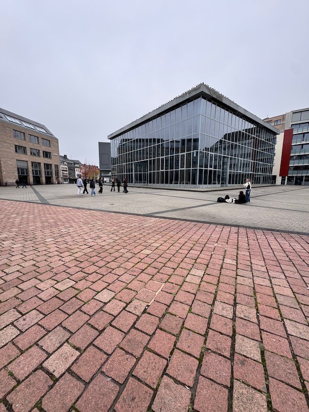 A modern glass building covers Roman ruins on the Viehmarkt square in Trier.