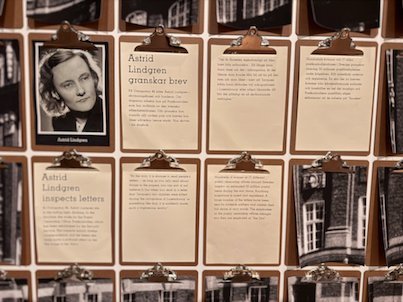 Exhibition wall with clipboards about Astrid Lindgren and her work as a letter inspector