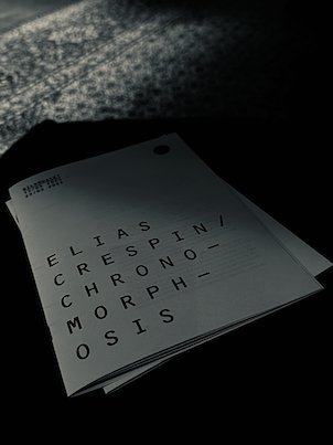 Brochure Elias Crespin, Chronomorphosis, on a dark surface at Bildmuseet